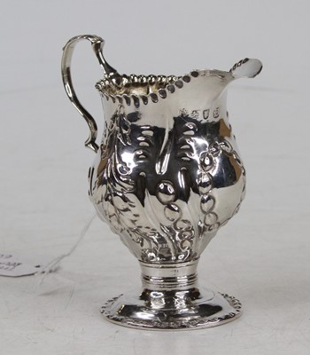 Lot 369 - A George II silver and embossed pedestal cream...