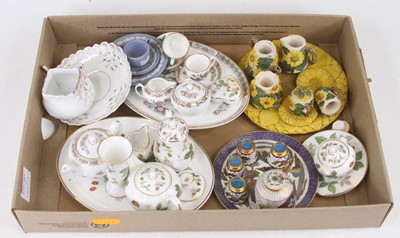 Lot 655 - A collection of miniature tea wares to include...