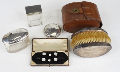 Lot 382 - Two silver topped glass dressing table jars...