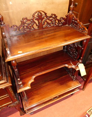 Lot 1238 - A contemporary American mahogany three tier...