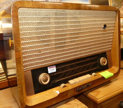 Lot 1242 - A 1960s His Master's Voice walnut radio, 35 x...