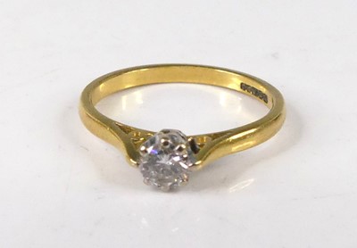 Lot 407 - An 18ct gold diamond solitaire ring, the claw...