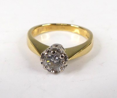 Lot 409 - An 18ct gold diamond solitaire ring, the claw...