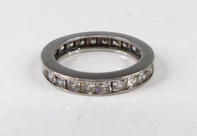 Lot 410 - A white metal and cz set eternity ring,...