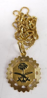 Lot 421 - A continental 18ct gold pendant on 18ct gold...