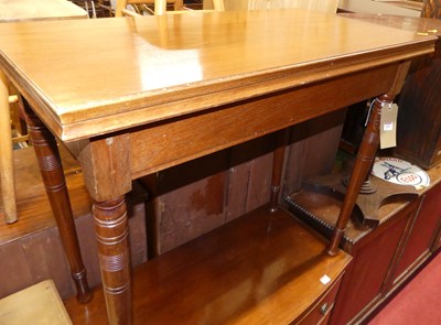 Lot 1269 - An Edwardian walnut fold-over tea table,...