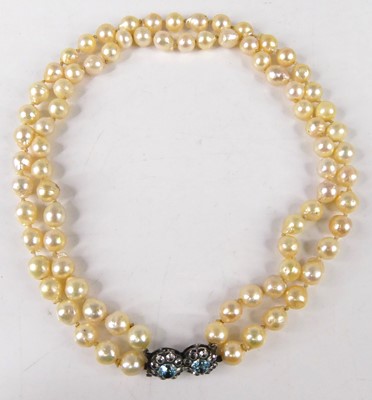 Lot 430 - A cultured pearl and paste set double string...