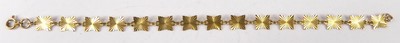 Lot 443 - A 9ct gold bracelet, arranged as bright cut...