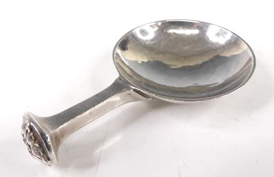 Lot 479 - An Arts & Crafts hammered silver caddy spoon,...