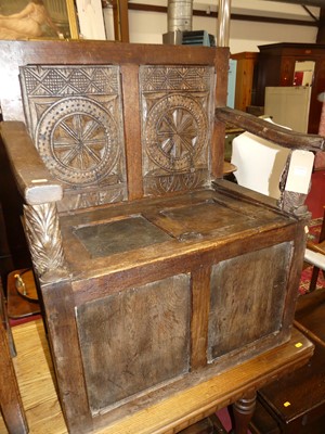 Lot 1298 - An antique joined oak twin panelled box seat...