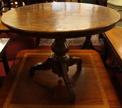 Lot 1310 - A hard wood circular pedestal centre table,...