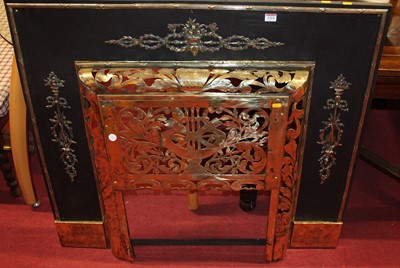 Lot 1314 - A French pierced brass and pressed metal fire...