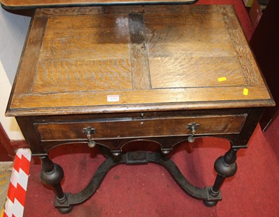 Lot 1321 - An early 20th century oak single drawer...