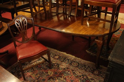 Lot 1325 - An Edwardian walnut D-end extending dining...