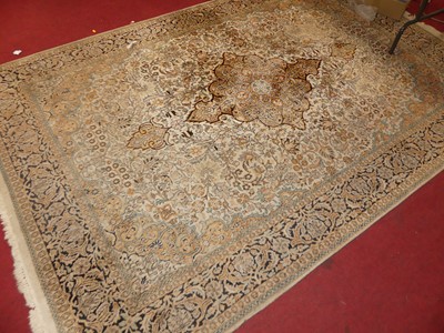 Lot 1191 - A Persian woollen pale ground Tabriz rug, the...