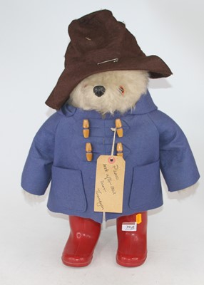 Lot 39 - A vintage Paddington Bear wearing a hat, blue...