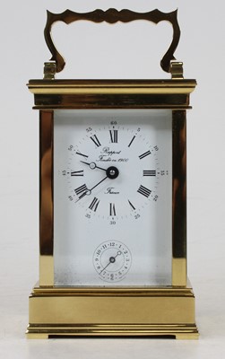 Lot 534 - A French lacquered brass cased carriage clock,...