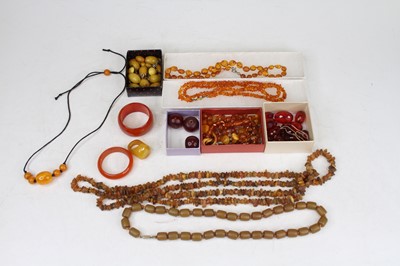 Lot 535 - A collection of simulated amber beads to...