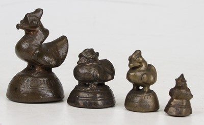 Lot 544 - A set of four eastern bronze graduated weights,...