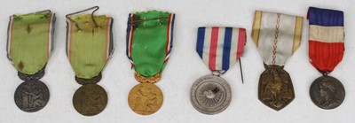 Lot 557 - A collection of medals to include a WWII...