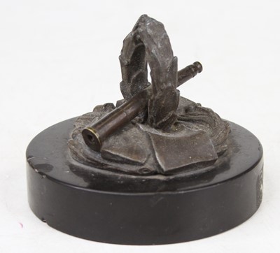 Lot 554 - A bronzed WW2 metal desk weight, in the form...