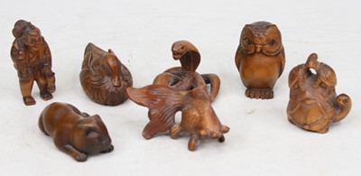 Lot 559 - A collection of seven Japanese carved boxwood...