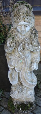 Lot 1407 - A reconstituted stone standing garden figure...