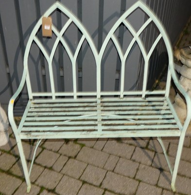 Lot 1411 - A painted wrought metal strap work two seater...