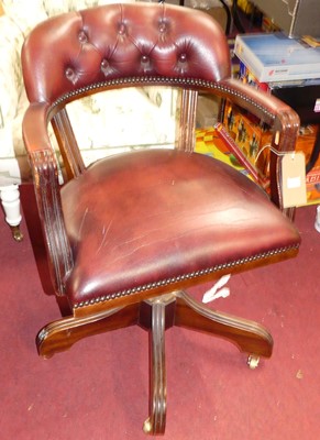 Lot 1339 - A reproduction mahogany and burgundy buttoned...