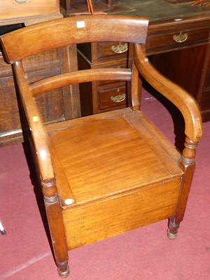 Lot 1353 - A Victorian mahogany hinge top commode elbow...