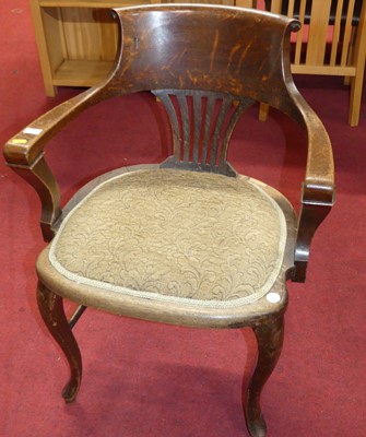 Lot 1357 - A 1920s oak splat back tub elbow desk chair,...