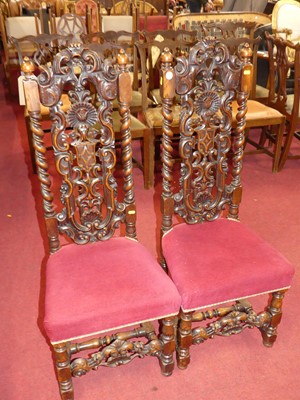 Lot 1358 - A pair of 19th century heavily carved walnut...