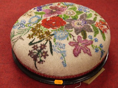 Lot 1366 - A Berlin beadwork topped circular low...