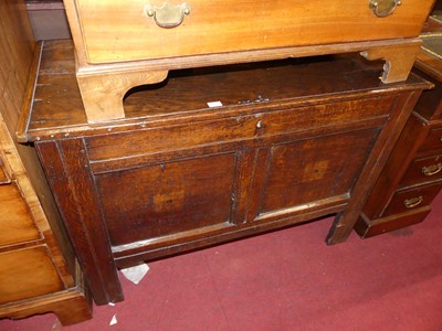 Lot 1372 - An 18th century joined oak hinge top twin...