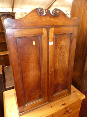 Lot 1403 - A Regency mahogany double door hanging wall...