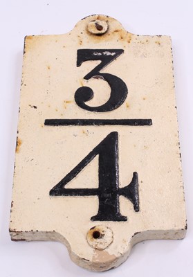 Lot 125 - A cast iron 3/4 mile advisory sign comprising...