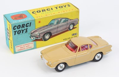 Lot 1066 - Corgi Toys No 228 Volvo P1800 comprising a tan...