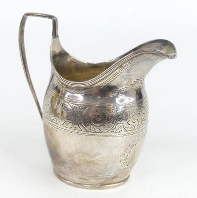 Lot 1144 - A George III silver cream jug, having reeded...