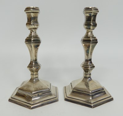 Lot 1211 - A pair of Elizabeth II silver candlesticks in...