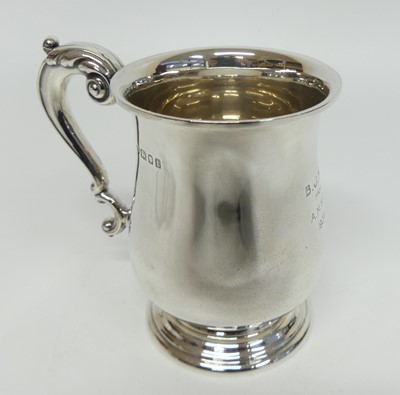 Lot 1204 - A George V silver tankard, of bell shape with...