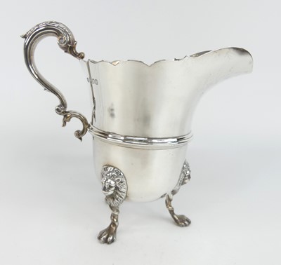 Lot 1177 - A late Victorian silver footed milk jug,...