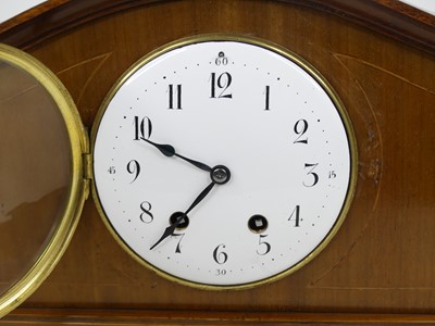 Lot 3 - An Edwardian walnut cased mantel clock, the...