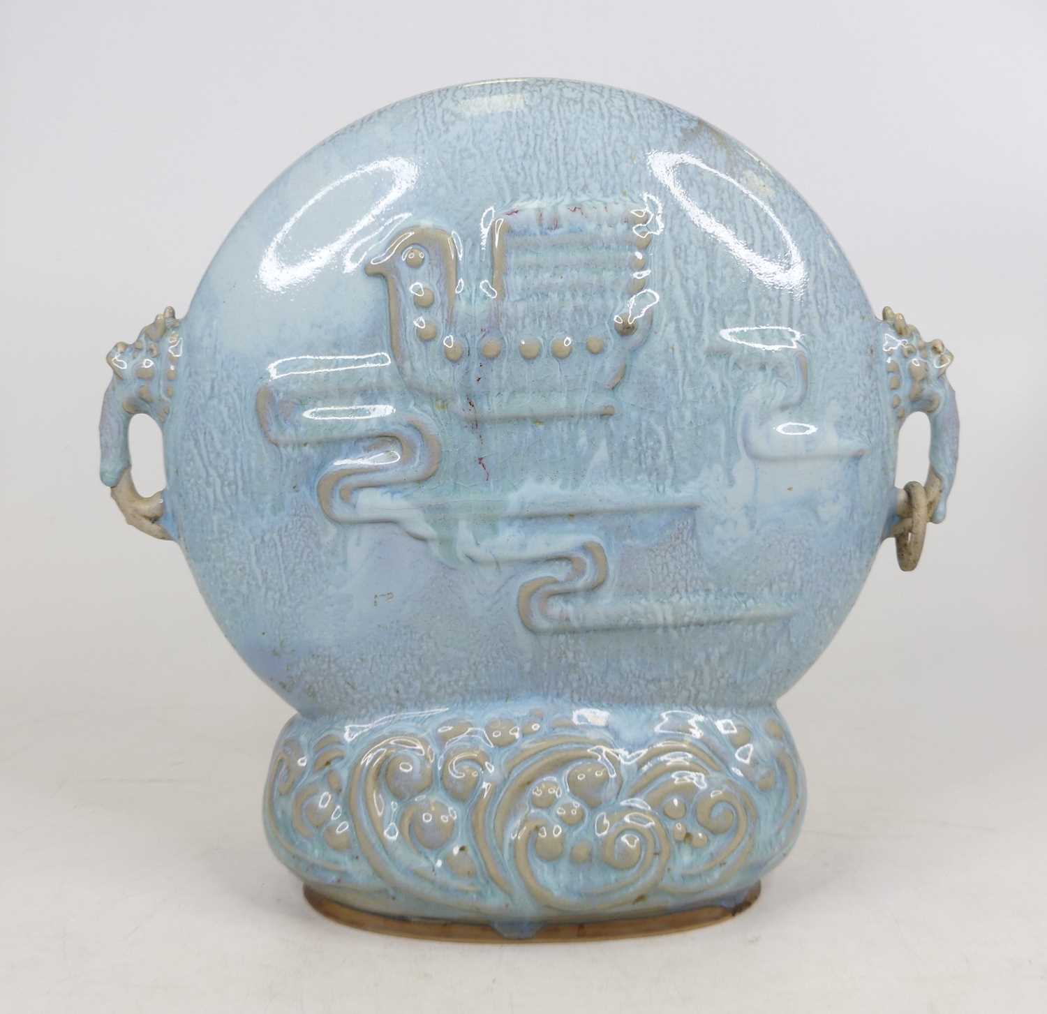Lot 11 - A Chinese blue glazed centre piece, relief...