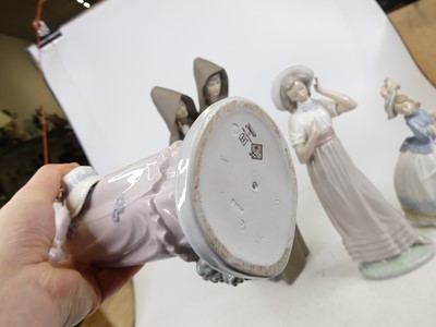Lot 181 - A Lladro bisque porcelain figure group of two...