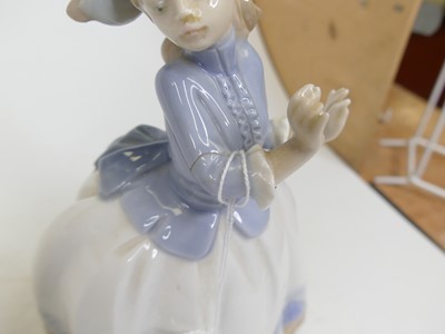 Lot 181 - A Lladro bisque porcelain figure group of two...