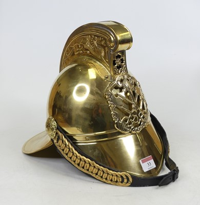 Lot 33 - A reproduction brass fireman's helmet, height...