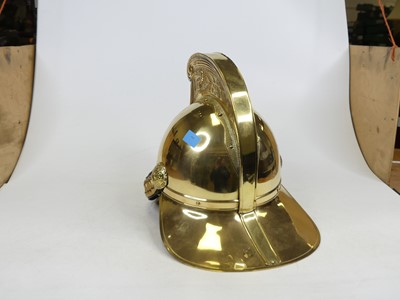 Lot 33 - A reproduction brass fireman's helmet, height...