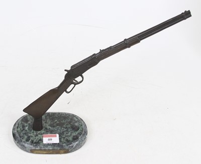 Lot 40 - A bronzed metal model of a Winchester model 94...