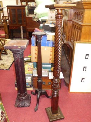 Lot 1145 - A spiral reeded mahogany pedestal plant stand...