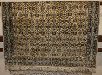 Lot 1185 - A Persian woollen Bokhara rug, the repeating...